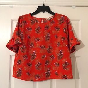 Orange blouse with flowers